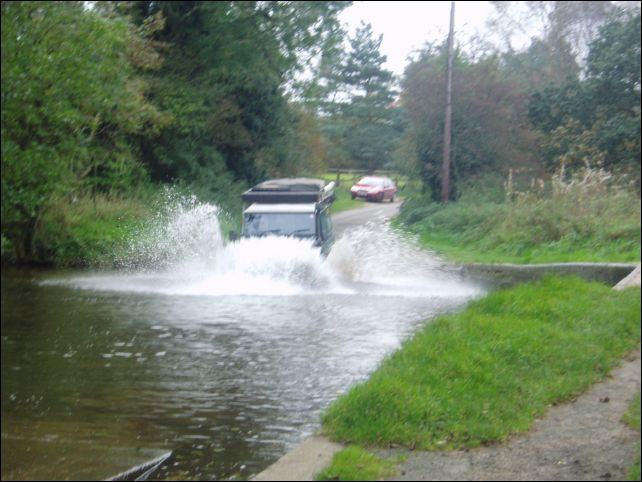 Splash - Debbie making sure the Landy gets a wash